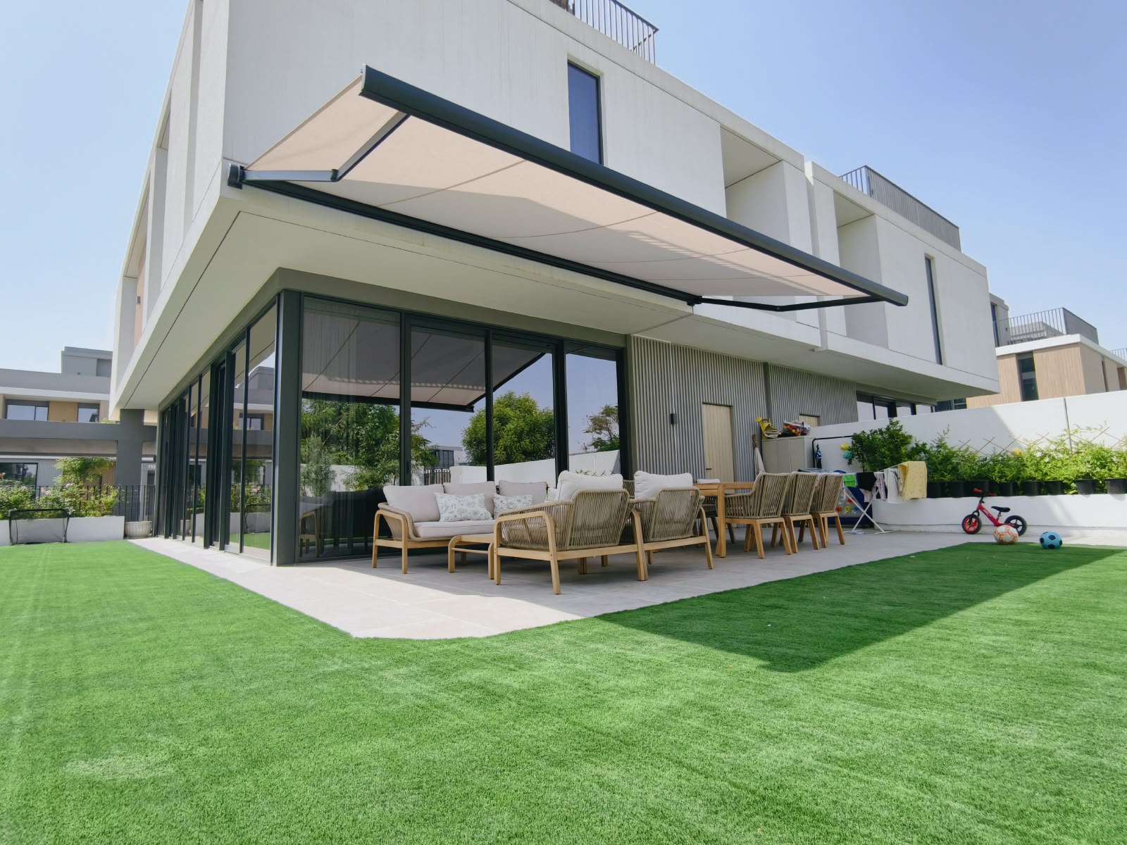 6x3m retractable awning installed over outdoor seating area in Arabian Ranches